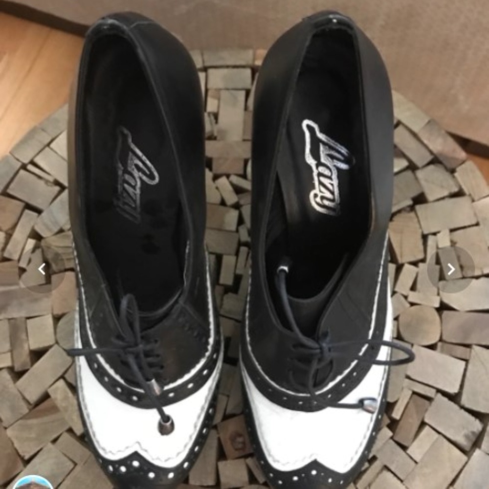 Pair of leather black and white leather shoes
